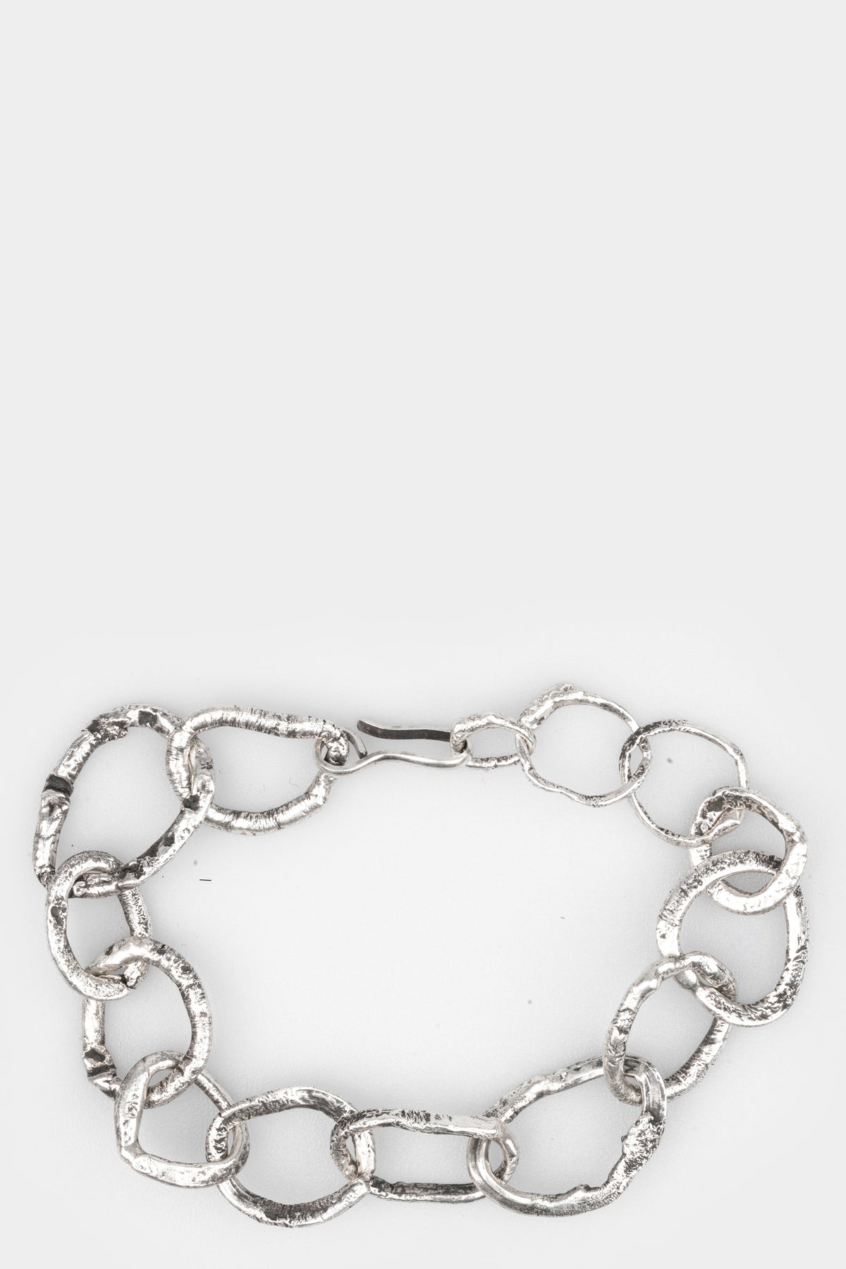 CUMA | Chunky silver bracelet, shot on table
