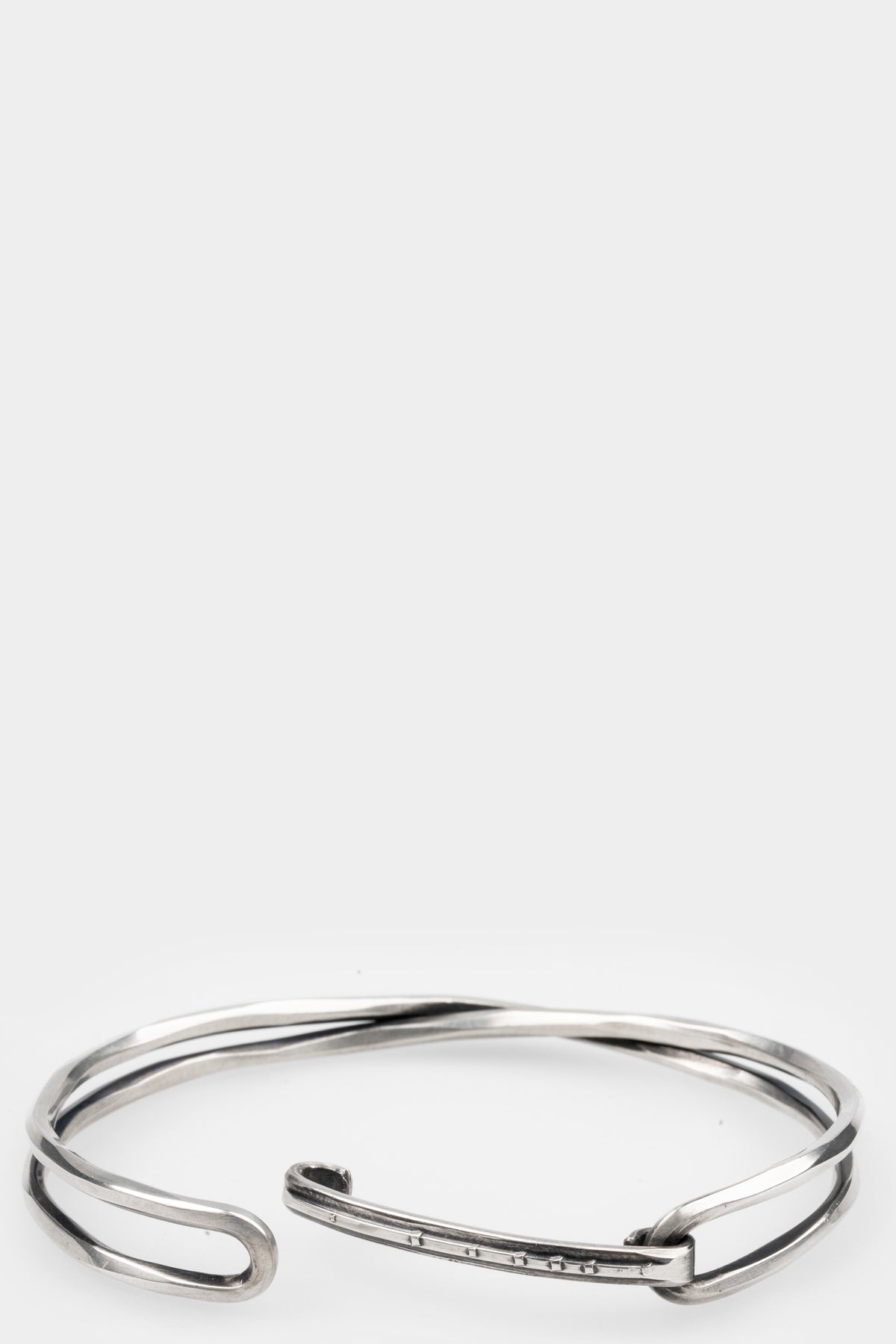 Crossed bangle bracelet