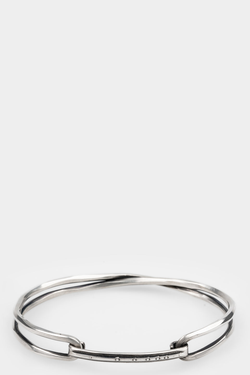 Crossed bangle bracelet