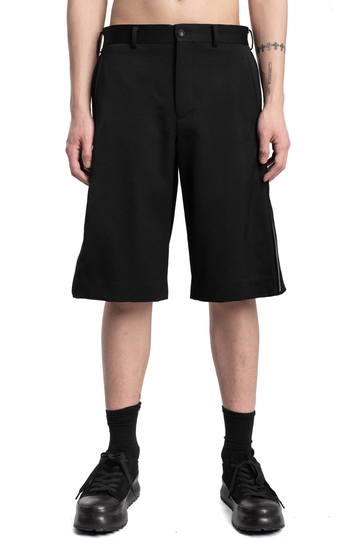 Comme des Garçons Homme Plus | SS26 - Wool gabardine side zip shorts P053, front view