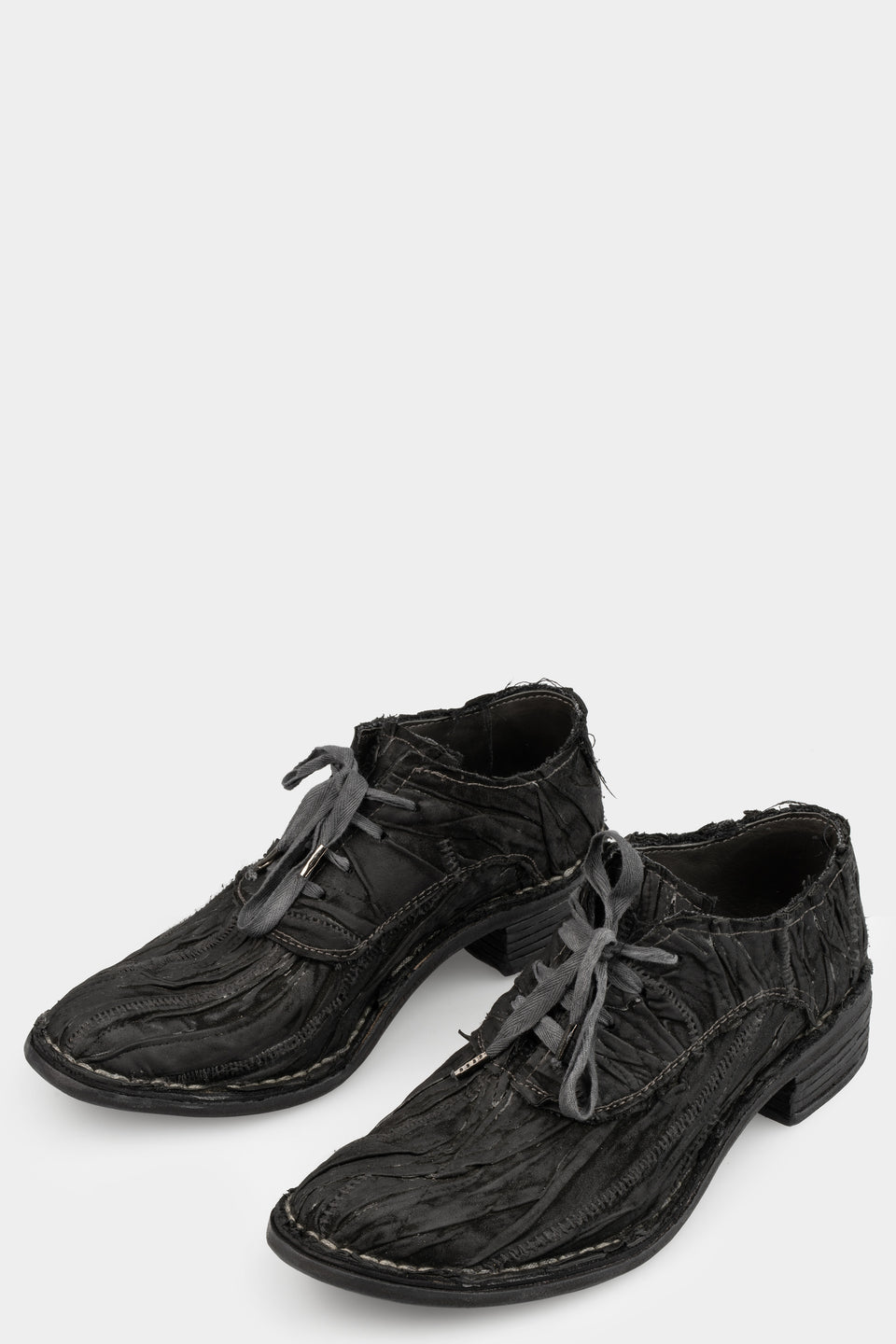 Layered waxed leather derbies