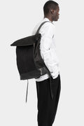 Silver stapled leather backpack